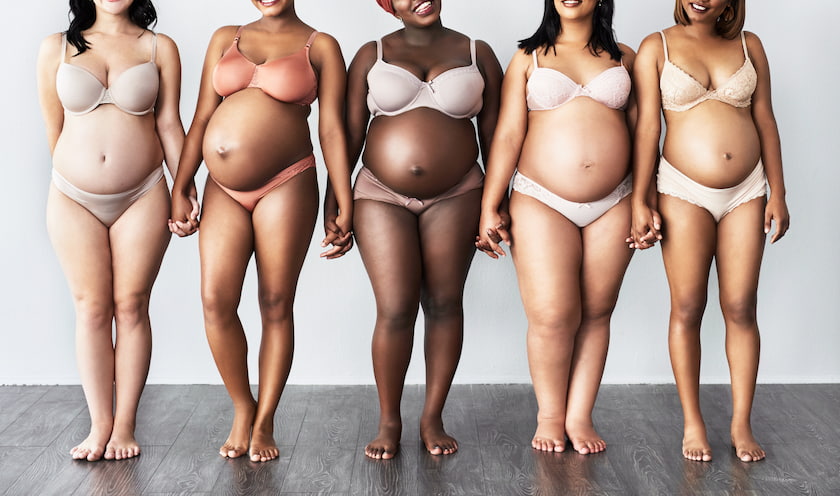 Pregnant women holding hands