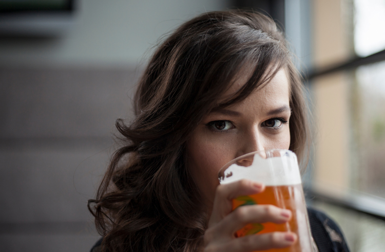 young woman drinking beer alcohol