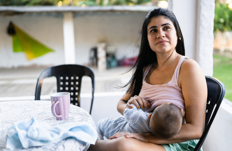 Breastfeeding mother latina feeds baby 