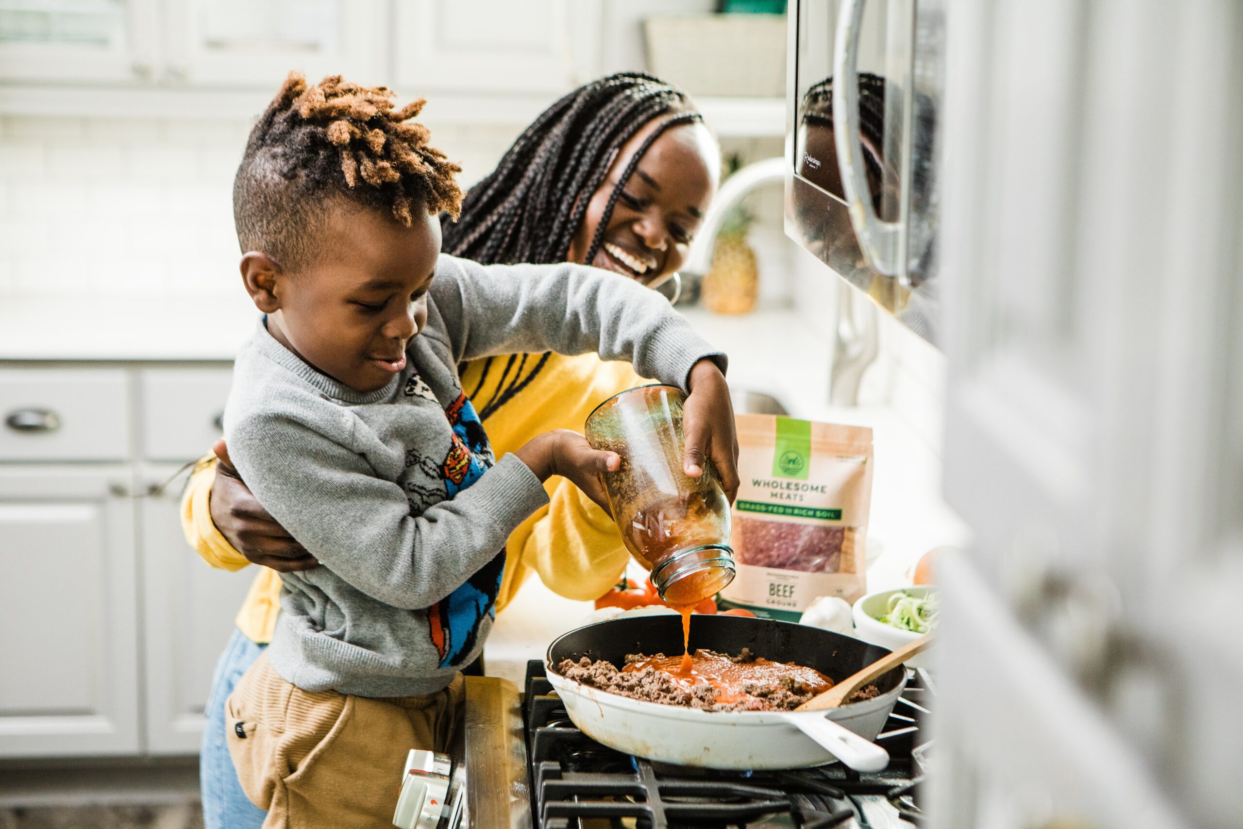 mother and son cooking brooke-lark-UX87Pz74ukY-unsplash