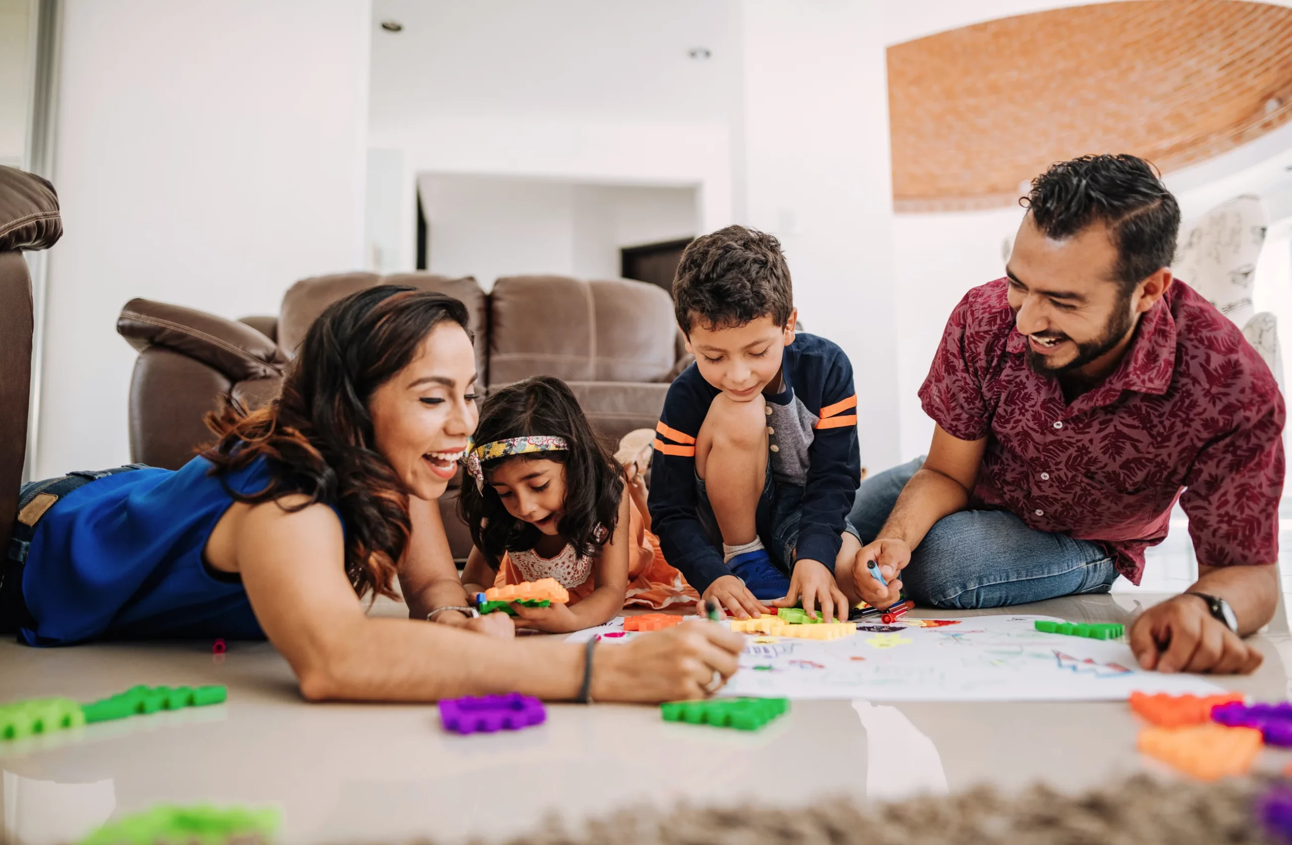 family playing games on the floor together
