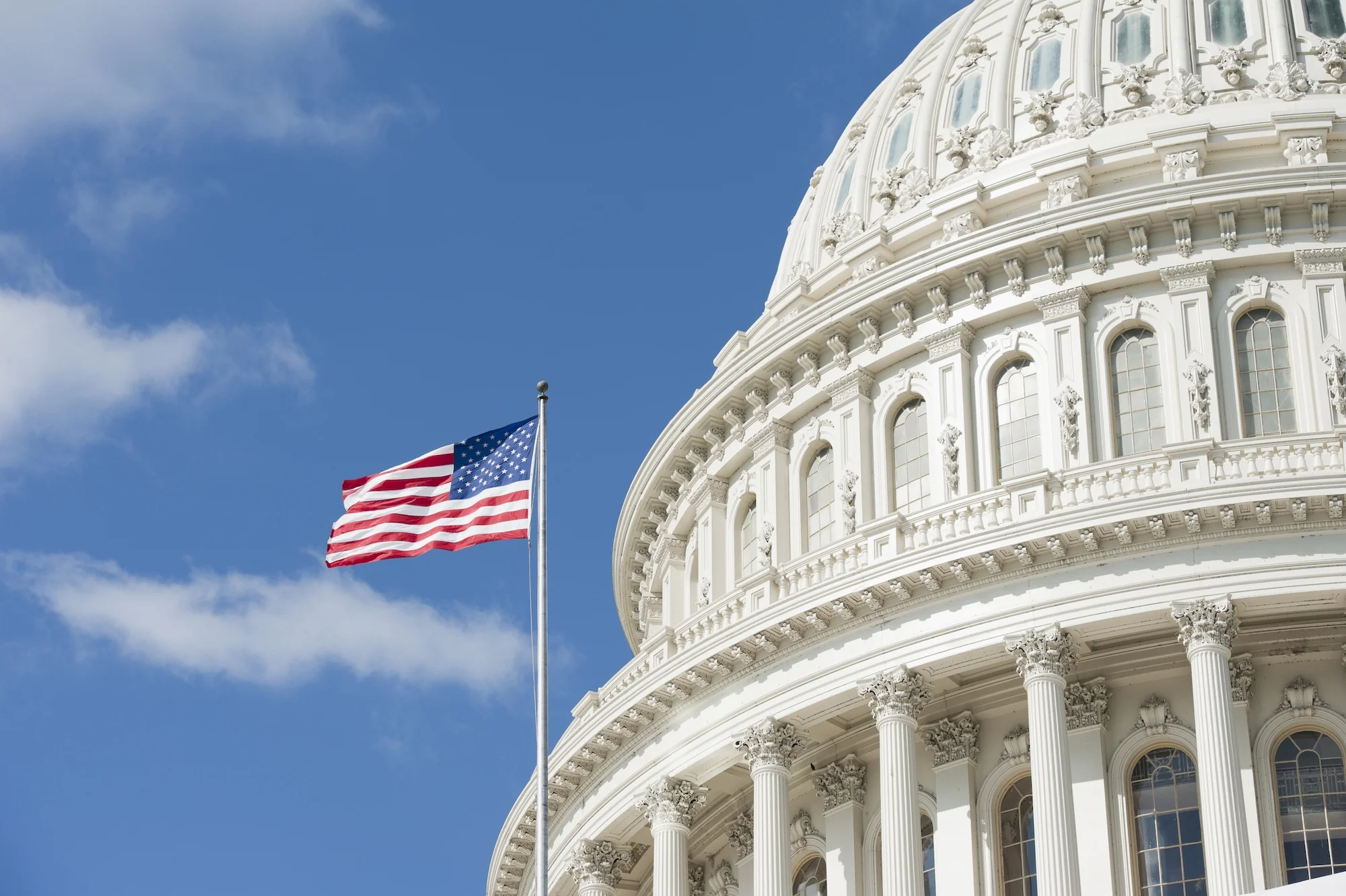 American-flag-waving-in-front-of-Capitol-Hill-155377752_2124x1413